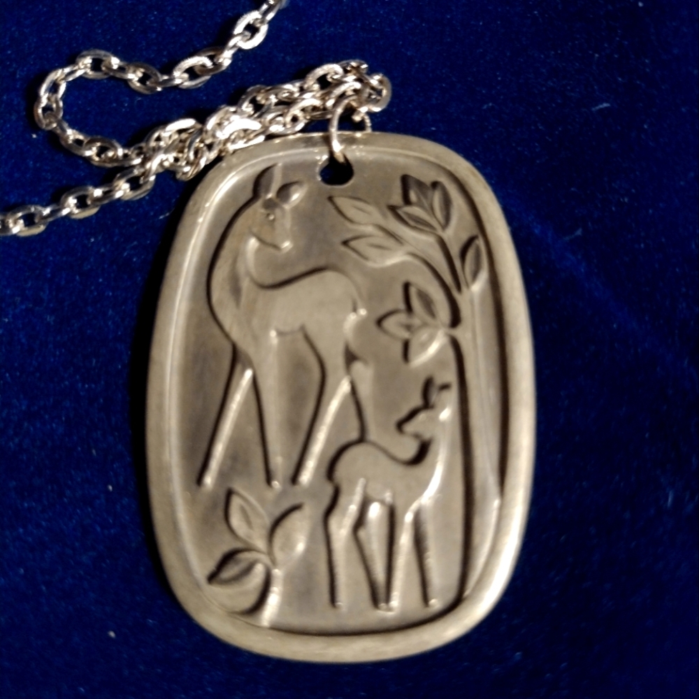 Vintage deer pendant marked Pewter H.S. Made in Norway. Pendant is approx. 2 in.